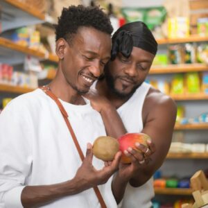Happy couple choosing fruits in a local grocery store in Portugal.